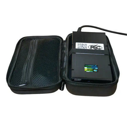 Charger device with black casing labeled Roger Charger SC, placed inside open black zippered carrying case with mesh pocket and connected power cable